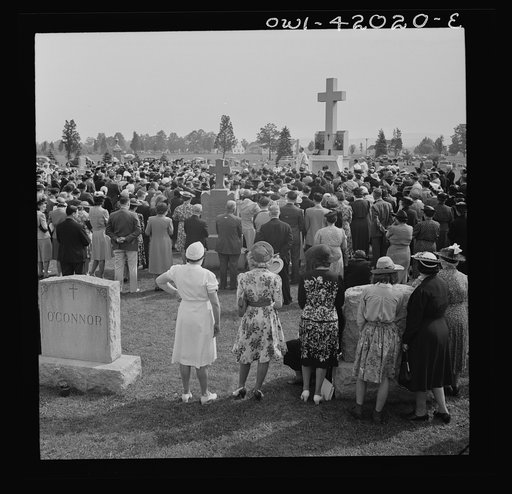 Untitled photo, possibly related to: Southington, Connecticut. On All Souls' Day, the Catholic congregation is gathering in the Saint Thomas Cemetery for an outdoor Mass which in 1942 was officiated by the Reverend Francis J. Mihalek