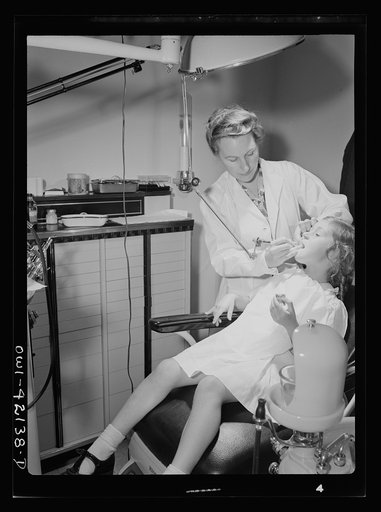 Southington, Connecticut. A little girl is having her teeth fixed in the Center's modern dental clinic
