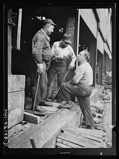 Southington, Connecticut. Workers talking to the foreman