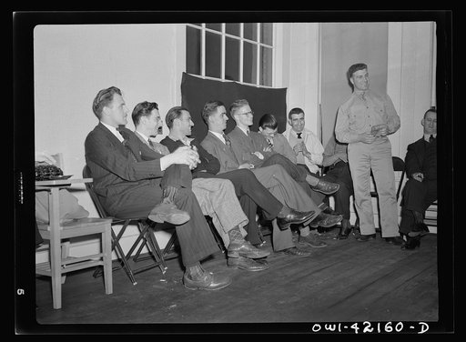 Southington, Connecticut. A group of young men soon to leave for army induction camps are listening to William Mongelo, of the U.S. Army Air Corps