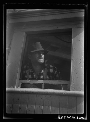Gloucester, Massachusetts. Captain John Riberia [i.e., Ribeiro] on the fishing trawler "Old Glory"
