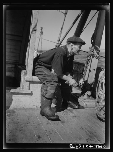 Portrait of a fisherman on board a fishing vessel out from Gloucester, Massachusetts