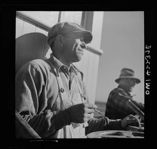 On board a fishing vessel, out from Gloucester, Massachusetts. A winch control man