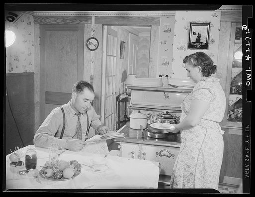 Gloucester, Massachusetts. Home again, Captain Riberia [i.e., Ribeiro] waits for his wife to prepare supper. Born in Brazil, brought up in the Portugal, he has been a fisherman for 23 years. He came to the United States in 1927