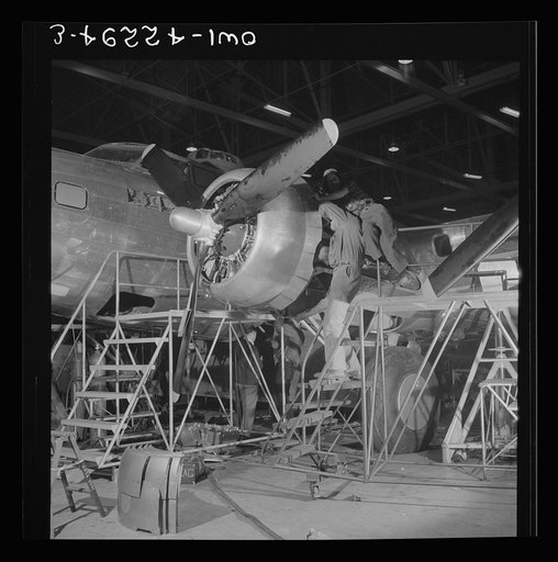 Seattle, Washington. Boeing aircraft plant. Production of B-17F (Flying Fortress) bombing planes. A nearly completed B-17F (Flying Fortress) bomber at the end of the production line