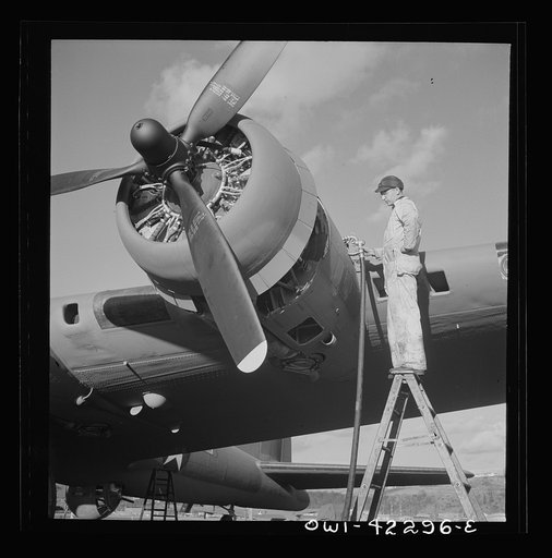 Seattle, Washington. Boeing aircraft plant. Production of B-17F (Flying Fortress) bombing planes. Lubricating and servicing a new B-17F (Flying Fortress) bombers