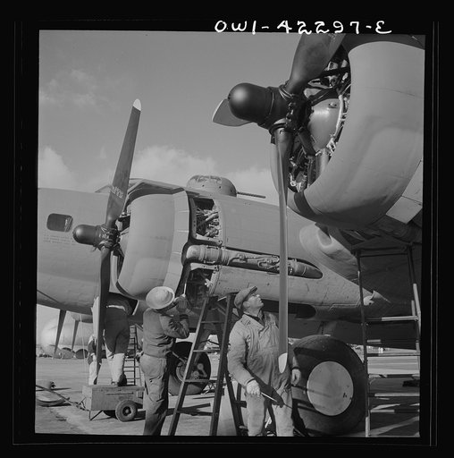 Seattle, Washington. Boeing aircraft plant. Production of B-17F (Flying Fortress) bombing planes. Lubricating and servicing a new B-17F (Flying Fortress) bombers