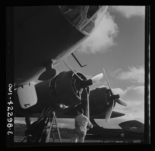 Seattle, Washington. Boeing aircraft plant. Production of B-17F (Flying Fortress) bombing planes. Lubricating and servicing a new B-17F (Flying Fortress) bombers