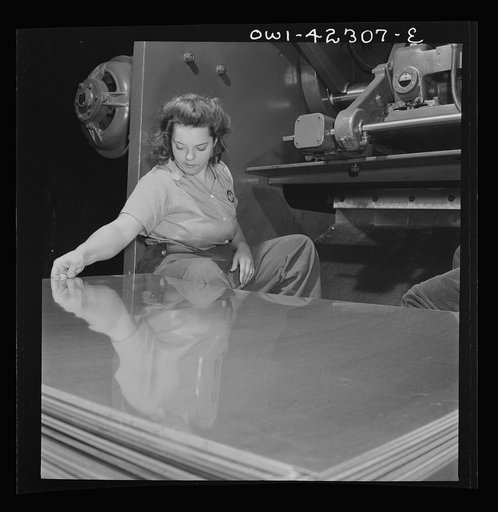 Boeing aircraft plant, Seattle, Washington. Production of B-17F (Flying Fortress) bombing planes. A sheet metal worker