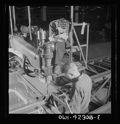 Boeing aircraft plant, Seattle, Washington. Production of B-17F (Flying Fortress) bombing planes. Spot welders