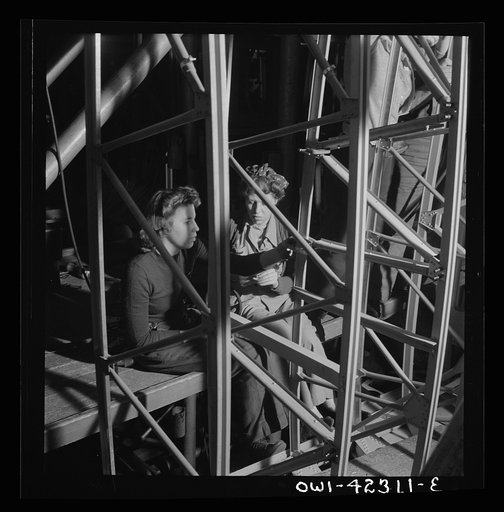 Boeing aircraft plant, Seattle, Washington. Production of B-17F (Flying Fortress) bombing planes. Women working on the fuselage framework