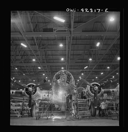 Untitled photo, possibly related to: Seattle, Washington. Boeing aircraft plant. Production of B-17F (Flying Fortress) bombing planes. A nearly completed B-17F (Flying Fortress) bomber at the end of the production line