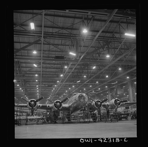 Untitled photo, possibly related to: Seattle, Washington. Boeing aircraft plant. Production of B-17F (Flying Fortress) bombing planes. A nearly completed B-17F (Flying Fortress) bomber at the end of the production line