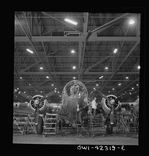 Untitled photo, possibly related to: Seattle, Washington. Boeing aircraft plant. Production of B-17F (Flying Fortress) bombing planes. A nearly completed B-17F (Flying Fortress) bomber at the end of the production line