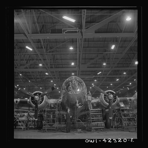 Untitled photo, possibly related to: Seattle, Washington. Boeing aircraft plant. Production of B-17F (Flying Fortress) bombing planes. A nearly completed B-17F (Flying Fortress) bomber at the end of the production line