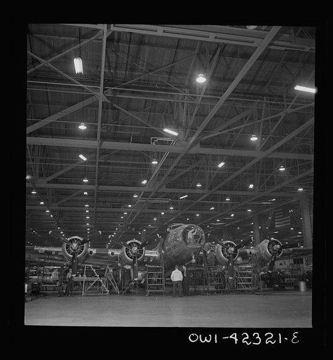 Untitled photo, possibly related to: Seattle, Washington. Boeing aircraft plant. Production of B-17F (Flying Fortress) bombing planes. A nearly completed B-17F (Flying Fortress) bomber at the end of the production line