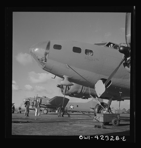 Untitled photo, possibly related to: Boeing aircraft plant, Seattle, Washington. Production of B-17F (Flying Fortress) bombing planes. Lubricating and servicing a new B-17F (Flying Fortress) bomber