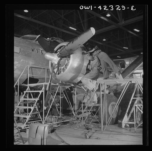 Untitled photo, possibly related to: Seattle, Washington. Boeing aircraft plant. Production of B-17F (Flying Fortress) bombing planes. A nearly completed B-17F (Flying Fortress) bomber at the end of the production line