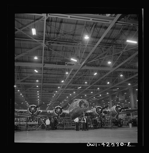Untitled photo, possibly related to: Seattle, Washington. Boeing aircraft plant. Production of B-17F (Flying Fortress) bombing planes. A nearly completed B-17F (Flying Fortress) bomber at the end of the production line