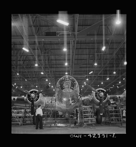 Untitled photo, possibly related to: Seattle, Washington. Boeing aircraft plant. Production of B-17F (Flying Fortress) bombing planes. A nearly completed B-17F (Flying Fortress) bomber at the end of the production line