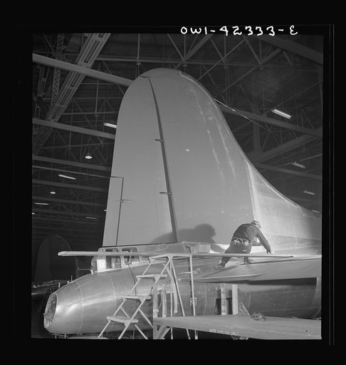 Untitled photo, possibly related to: Production. B-17 heavy bomber. The tail and rudder of a mighty B-17F (Flying Fortress) bomber near completion at the Boeing plant in Seattle.  The Flying Fortress has performed with great credit in the South Pacific, over Germany and elsewhere. It is a four-engin