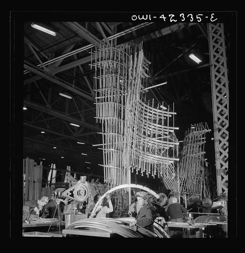 Untitled photo, possibly related to: Seattle, Washington. Boeing aircraft plant. Production of B-17F (Flying Fortress) bombing planes. Sections of framework