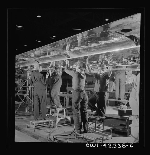 Untitled photo, possibly related to: Boeing aircraft plant, Seattle, Washington. Production of B-17F (Flying Fortress) bombing planes. Women assembling a wing