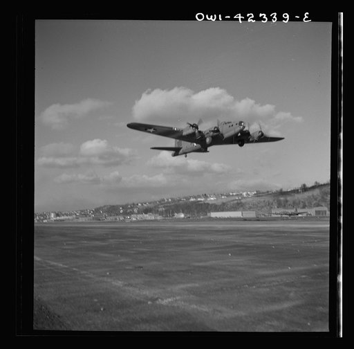 Untitled photo, possibly related to: Production. B-17 heavy bomber. Another mighty B-17F (Flying Fortress) bomber sets out on a test flight from the airfield of Boeing's Seattle plant. The Flying Fortress has performed with great credit in the South Pacific, over Germany and elsewhere. It is a four-