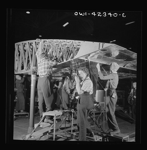 Untitled photo, possibly related to: Boeing aircraft plant, Seattle, Washington. Production of B-17F (Flying Fortress) bombing planes. Women assembling a wing