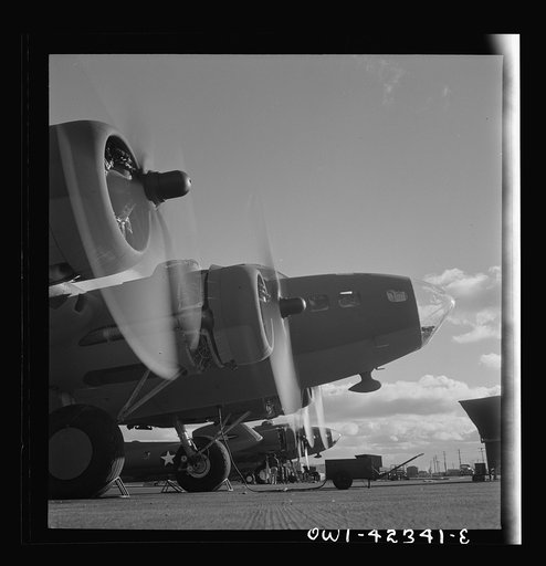 Untitled photo, possibly related to: Production. B-17 heavy bomber. Two of the four mighty engines of a new B-17F (Flying Fortress) bombers warm up at the airfield of Boeing's Seattle plant as another warship of the air awaits its flight test. The Flying Fortress has performed with great credit in t