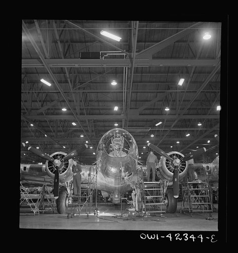 Untitled photo, possibly related to: Seattle, Washington. Boeing aircraft plant. Production of B-17F (Flying Fortress) bombing planes. A nearly completed B-17F (Flying Fortress) bomber at the end of the production line