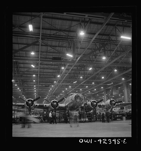 Untitled photo, possibly related to: Seattle, Washington. Boeing aircraft plant. Production of B-17F (Flying Fortress) bombing planes. A nearly completed B-17F (Flying Fortress) bomber at the end of the production line