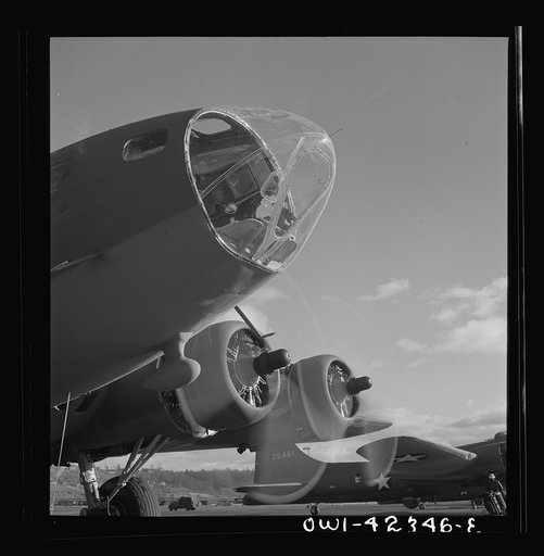 Untitled photo, possibly related to: Boeing aircraft plant, Seattle, Washington. Production of B-17F (Flying Fortress) bombing planes. The bombadier's compartment in the nose
