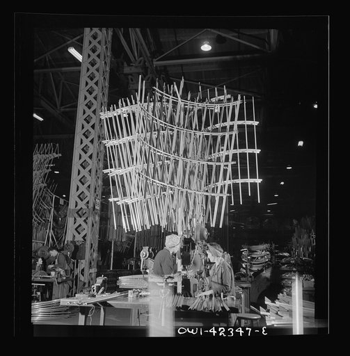 Untitled photo, possibly related to: Seattle, Washington. Boeing aircraft plant. Production of B-17F (Flying Fortress) bombing planes. Sections of framework