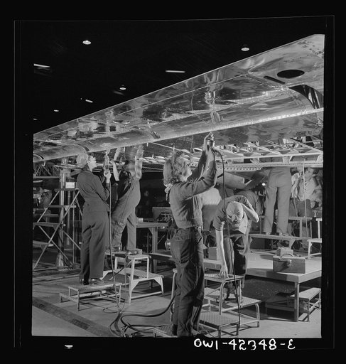 Untitled photo, possibly related to: Boeing aircraft plant, Seattle, Washington. Production of B-17F (Flying Fortress) bombing planes. Women assembling a wing