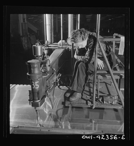 Untitled photo, possibly related to: Boeing aircraft plant, Seattle, Washington. Production of B-17F (Flying Fortress) bombing planes. Spot welders