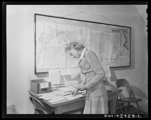 United Nations Relief and Rehabilitation Administration training center, University of Maryland. College Park, Maryland. Miss. Dixie Bacot, a member of the clerical staff, sorting the mail for the students in the lobby of the administration building