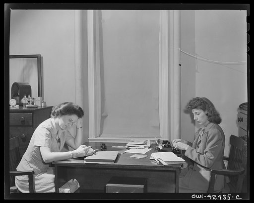 United Nations Relief and Rehabilitation Administration training center, University of Maryland, College Park, Maryland. Two of the appointees for duty overseas seated at their study desks. Students attend regular classes and are given assignments which deal with problems and conditions they will en