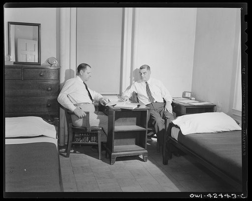 United Nations Relief and Rehabilitation Administration training center, University of Maryland, College Park, Maryland. Two students discussing and studying their next day's classroom work in their dormitory rooms