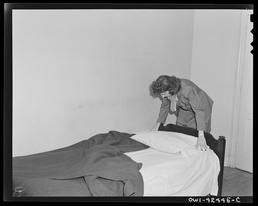 United Nations Relief and Rehabilitation Administration training center, University of Maryland, College Park, Maryland. An United Nations Relief and Rehabiliation Administration trainee, who is slated for duty overseas as soon as her indoctrination is completed, making up her own bed in the dormito