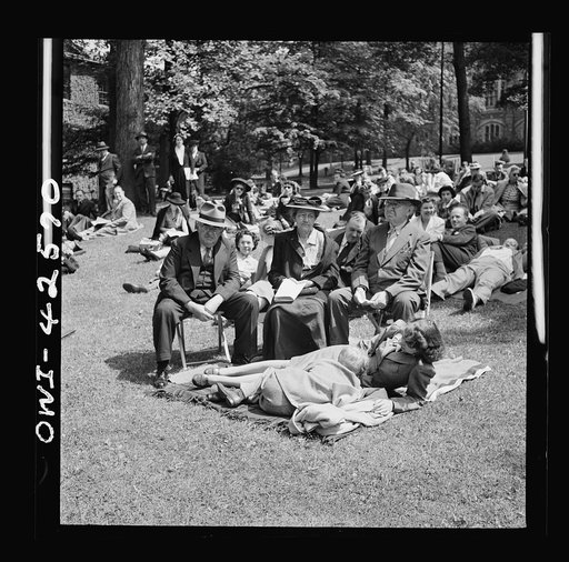Bethlehem, Pennsylvania. Bach festival. People on the lawn outside Packer Memorial Chapel during an afternoon performance of the choir