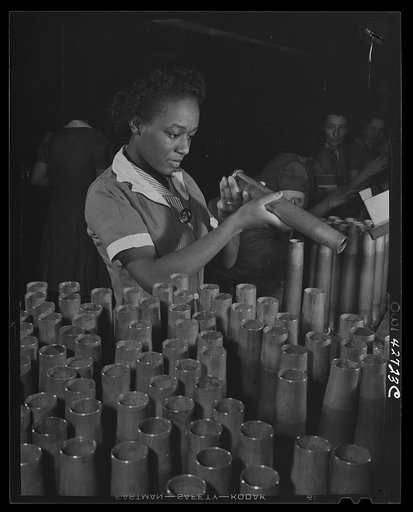 Frankford Arsenal, Philadelphia, Pennsylvania.] Bertha Stallworth, age twenty-one, inspecting the end of a forty millimeter artillery cartridge case at the Frankfort [i.e. Frankford] Arsenal