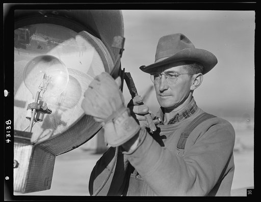 Columbia Steel Company at Geneva, Utah. Serving one of the floodlights that turn night into day at the big construction operations for a new steel plant which will make important additions to the vast amount of steel needed for the war effort
