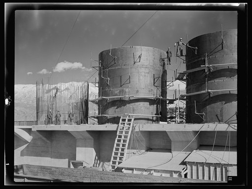 Columbia Steel Company at Geneva, Utah. The erecting crane is kept busy as blast furnaces take form in a new steel mill under construction which will make important additions to the vast amount of steel needed for the war effort