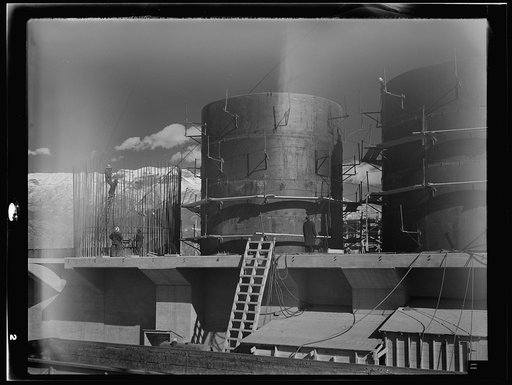 Untitled photo, possibly related to: Columbia Steel Company at Geneva, Utah. The erecting crane is kept busy as blast furnaces take form in a new steel mill under construction which will make important additions to the vast amount of steel needed for the war effort