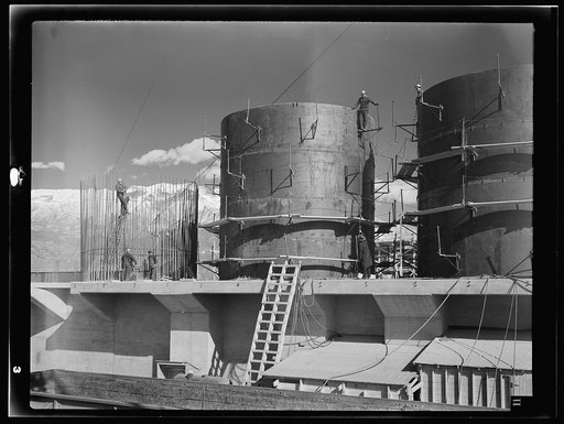 Untitled photo, possibly related to: Columbia Steel Company at Geneva, Utah. The erecting crane is kept busy as blast furnaces take form in a new steel mill under construction which will make important additions to the vast amount of steel needed for the war effort