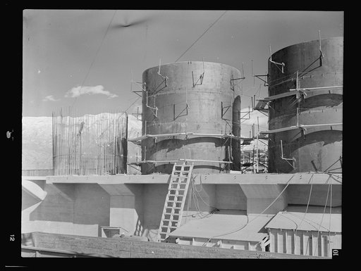 Untitled photo, possibly related to: Columbia Steel Company at Geneva, Utah. The erecting crane is kept busy as blast furnaces take form in a new steel mill under construction which will make important additions to the vast amount of steel needed for the war effort