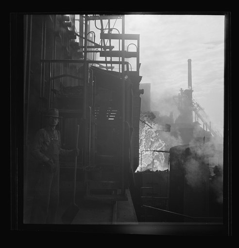 Untitled photo, possibly related to: Columbia Steel Company at Ironton, Utah. Discharging coke oven