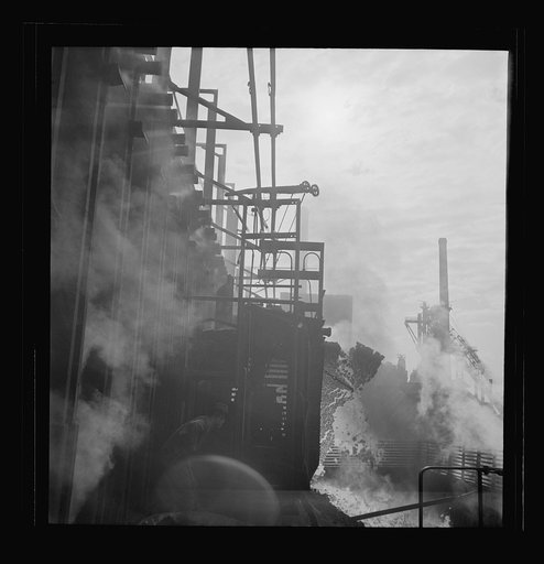 Untitled photo, possibly related to: Columbia Steel Company at Ironton, Utah. Discharging coke oven