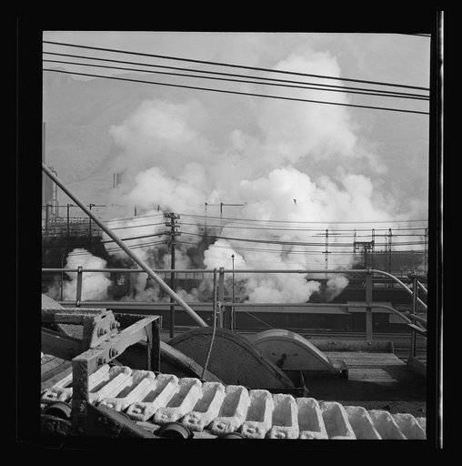 Columbia Steel Company at Ironton, Utah. Looking upon coke ovens. The steam indicates that coke is being wetted
